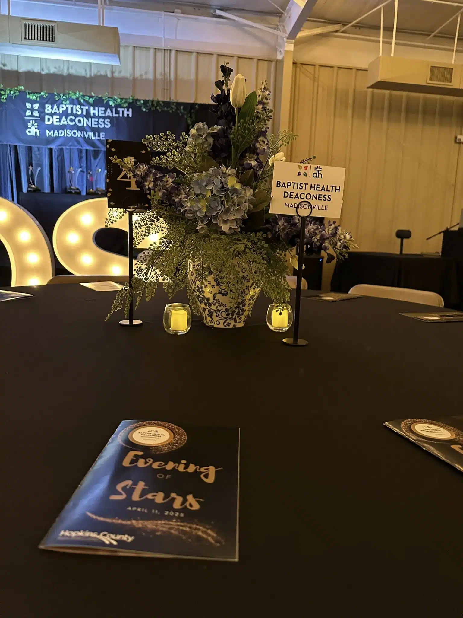 Table and floral centerpiece at Evening of Stars event